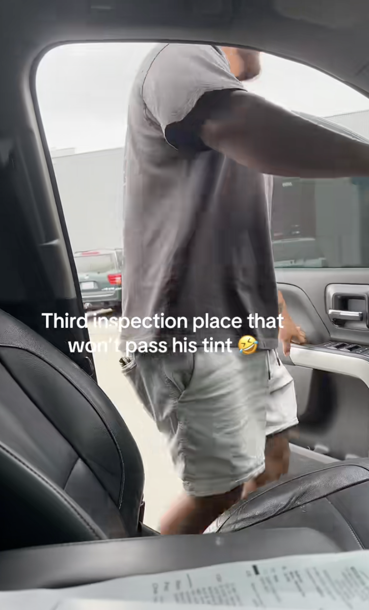 man getting into a car